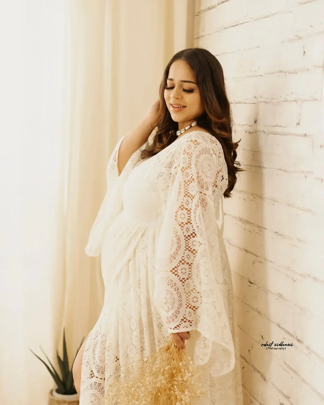 FlairNFrillz Zoya Boho Lace Maternity Dress with flowing fabric and intricate lace details, perfect for special occasions.