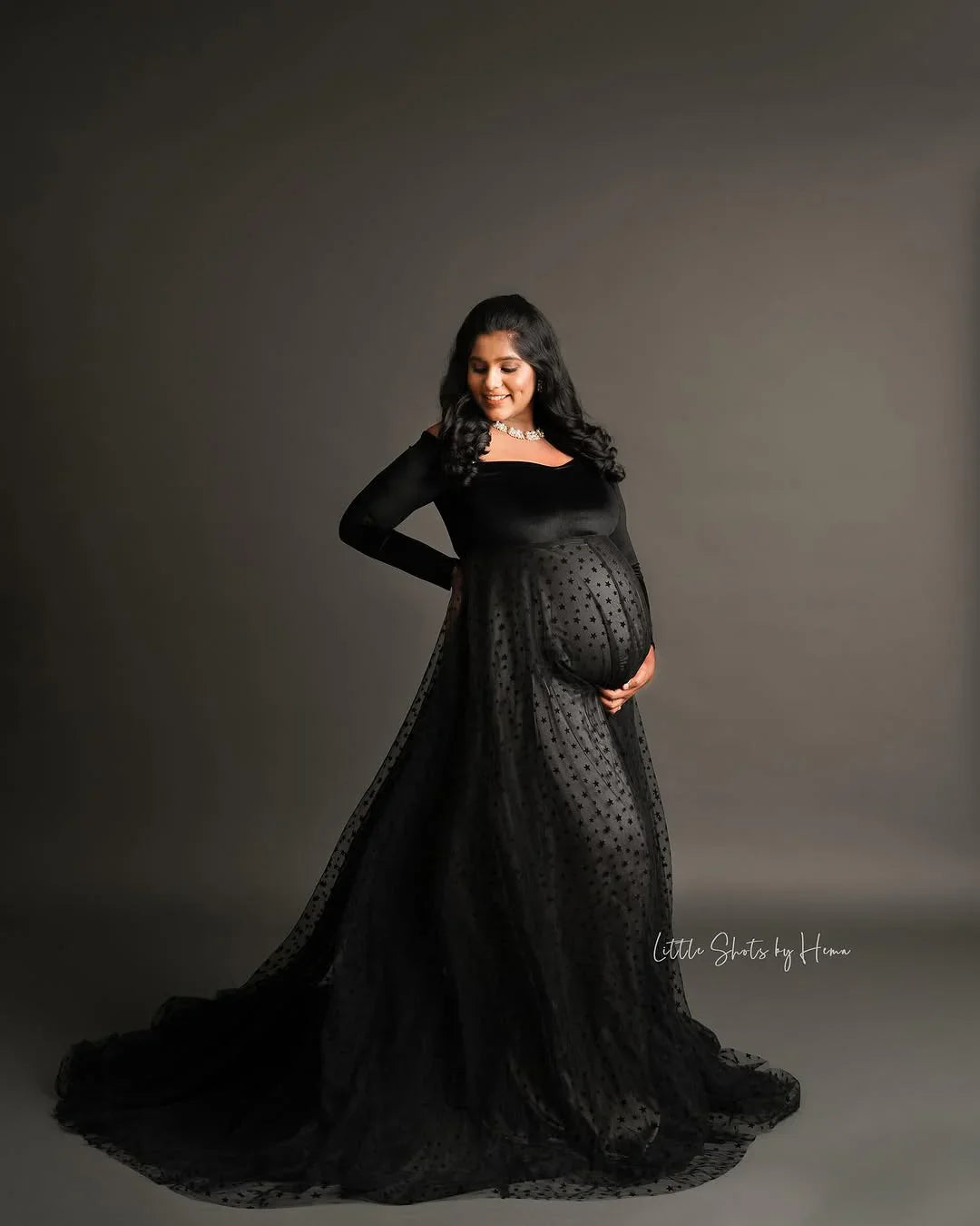 Elegant Iliana Gown maternity dress by FlairNFrillz, flowing fabric with lace details, perfect for expecting mothers.