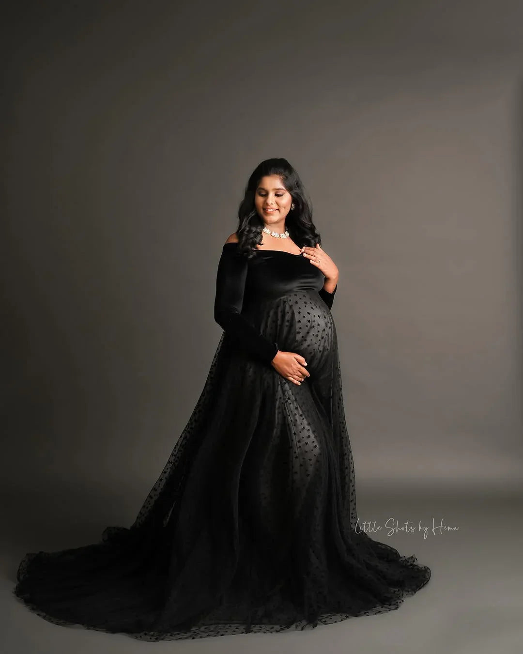 Elegant Iliana Gown maternity dress by FlairNFrillz, featuring a flowing fabric and comfortable fit for expecting mothers.