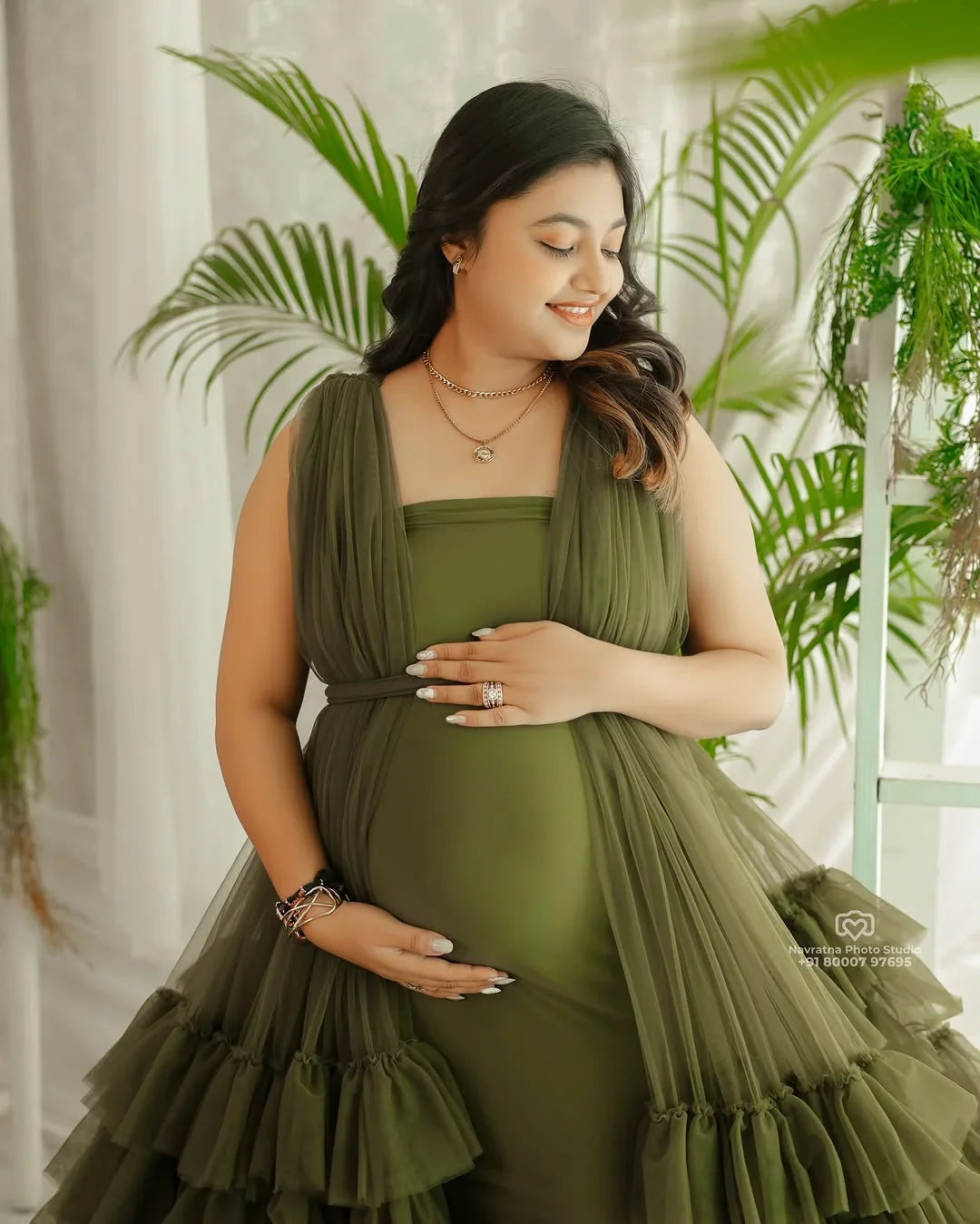 FlairNFrillz Delilah Olive Maternity Robe Gown with long sleeves and flowing fabric, perfect for comfortable maternity wear.