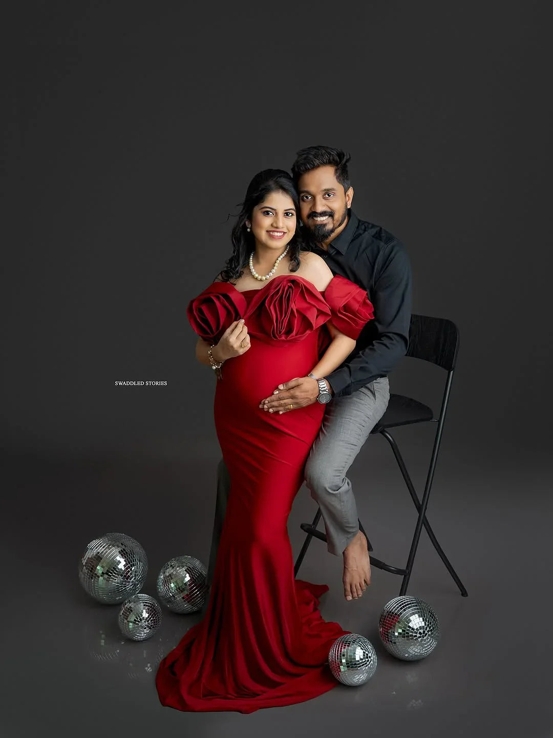 Johanna Maroon maternity gown by FlairNFrillz featuring a flowing fabric and elegant design suitable for expectant mothers.